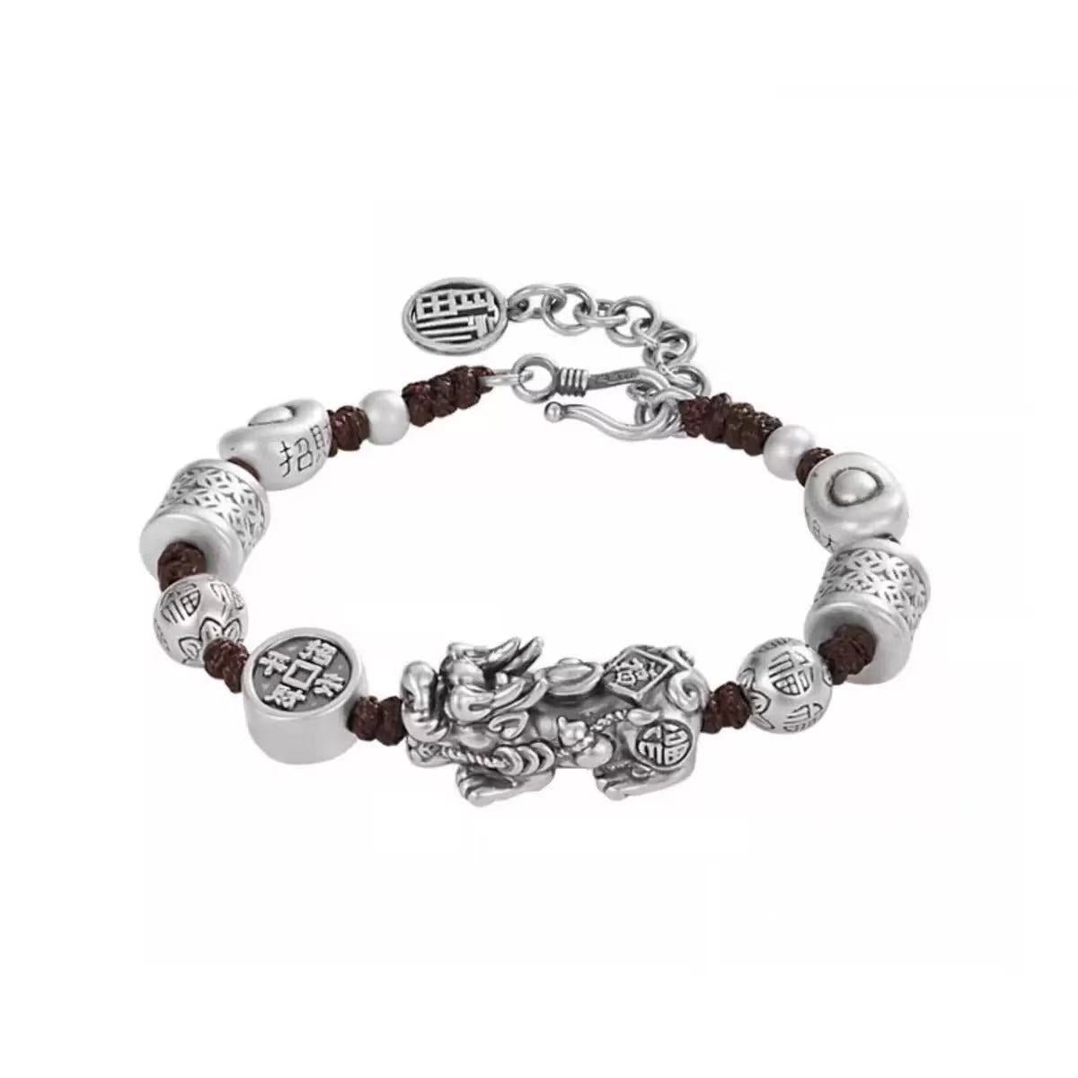 Detail of S-hook clasp and extension chain on a hand-woven cotton copper bracelet