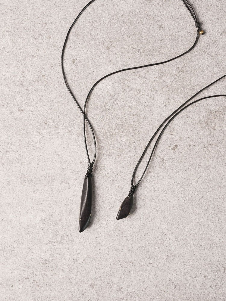 Hand-Polished Ebony Spear Pendant with Brass Inlays