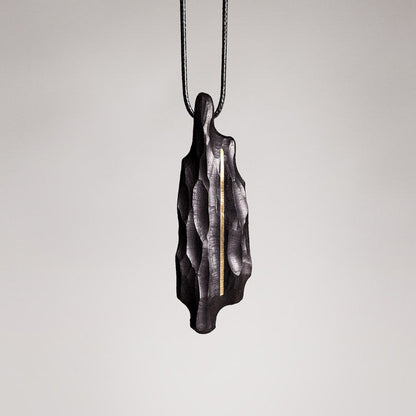 Artisan Chiseled Ebony Totem with Vertical Brass Inlay