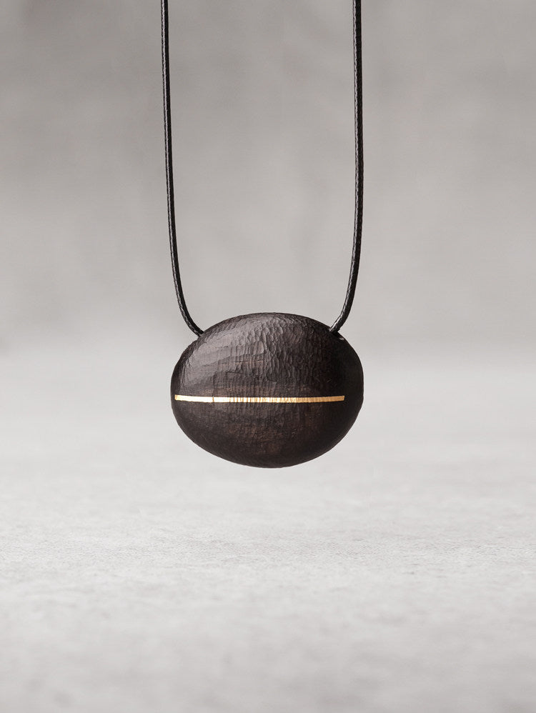 Hand-Chiseled Ebony "Orb" Pendant with Brass Filament