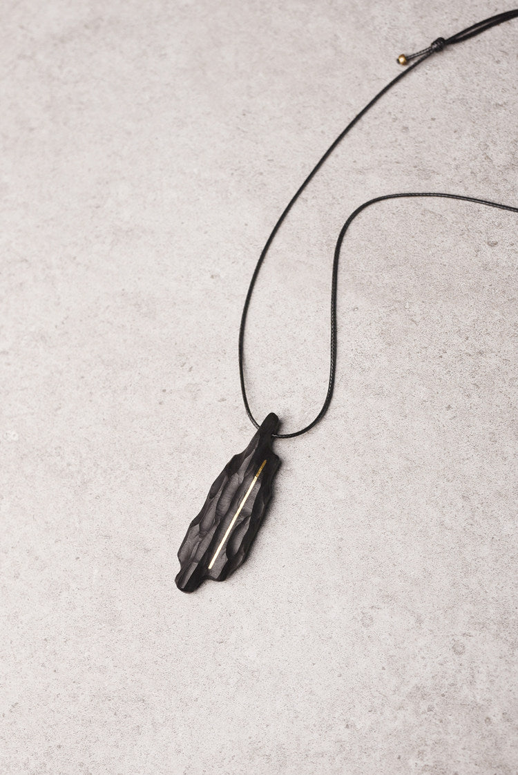 Artisan Chiseled Ebony Totem with Vertical Brass Inlay