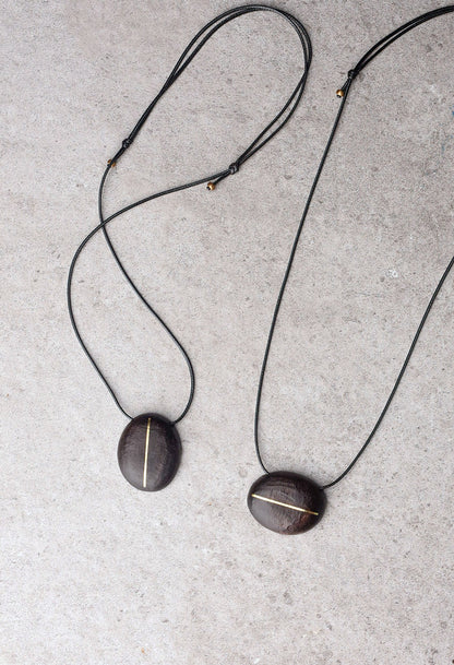 Hand-Chiseled Ebony "Orb" Pendant with Brass Filament
