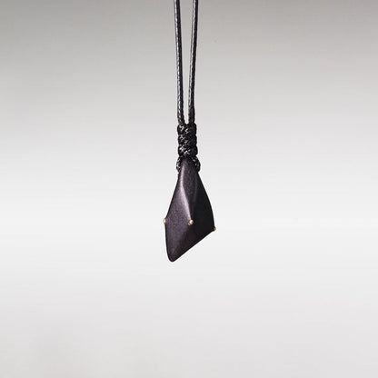 Hand-Polished Ebony Spear Pendant with Brass Inlays