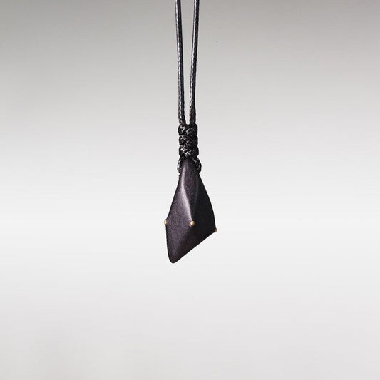 Hand-Polished Ebony Spear Pendant with Brass Inlays