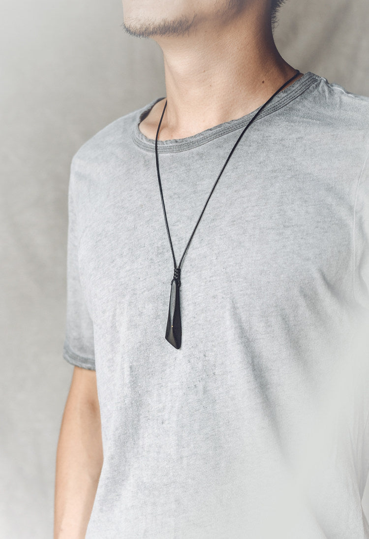 Hand-Polished Ebony Spear Pendant with Brass Inlays