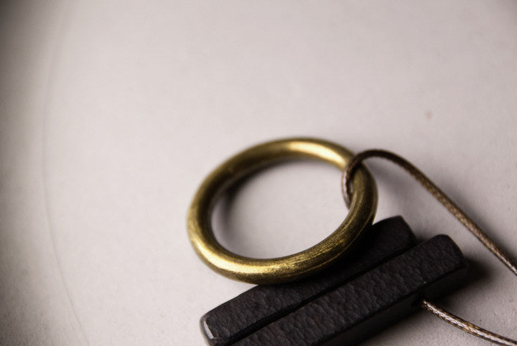 Hand-Chiseled Ebony "Orb" Pendant with Brass Filament