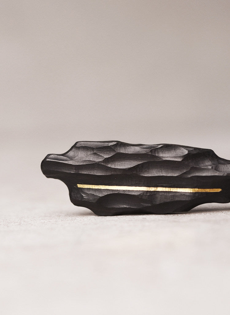 Artisan Chiseled Ebony Totem with Vertical Brass Inlay