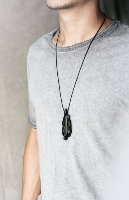 Artisan Chiseled Ebony Totem with Vertical Brass Inlay