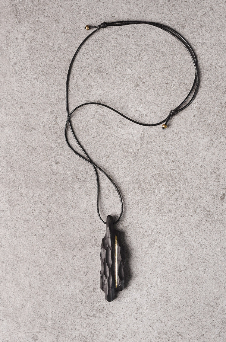 Artisan Chiseled Ebony Totem with Vertical Brass Inlay