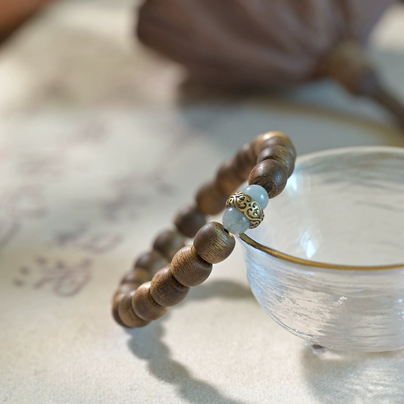 Hand-carved Wooden Bead Bracelet with Buddha Accent - A Path to Balance and Peace