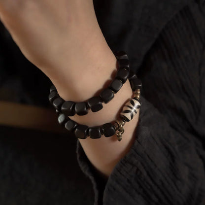 Double Tiger-Tooth Dzi & Ebony Bracelet for Protection & Royal Energy