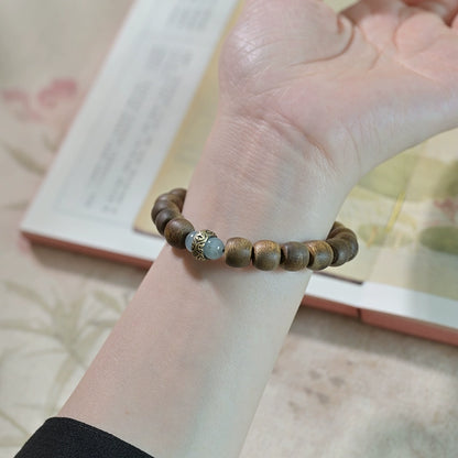 Hand-carved Wooden Bead Bracelet with Buddha Accent - A Path to Balance and Peace