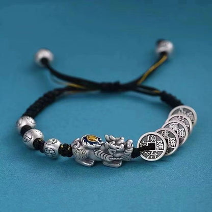 Black braided cord bracelet with silver Pixiu charm and ancient coin beads for protection