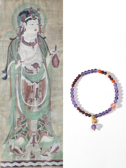 Spiritual Feng Shui jewelry: Amethyst and Red Agate bracelet displayed next to traditional Buddhist art