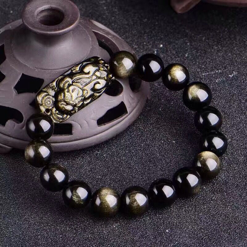 Natural Golden Obsidian bracelet featuring a hand-carved 3D Pixiu beast and beads with double gold eye sheen